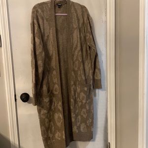Long sleeve knee length cardigan.